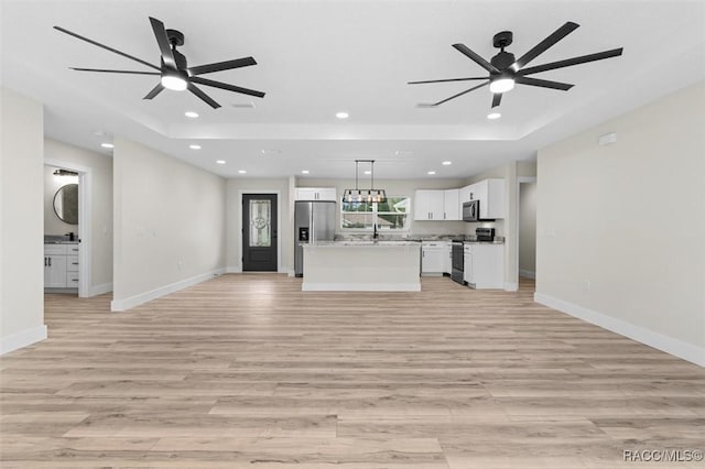 2828 E Celina St, Inverness, FL 34453 - unfurnished living room with light wood-type flooring, a ceiling fan, and recessed lighting