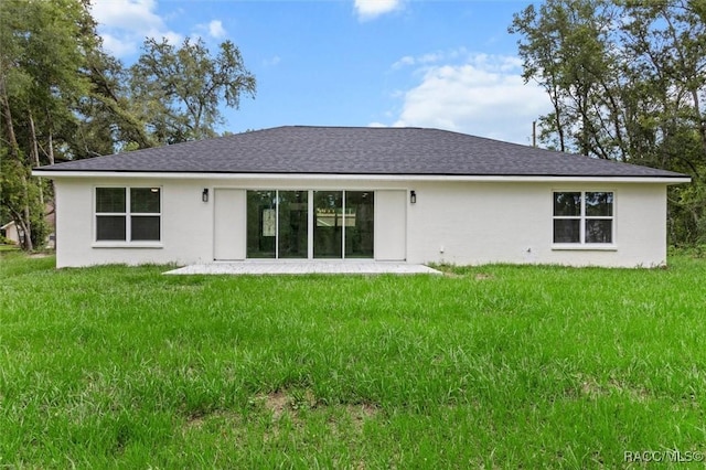 2828 E Celina St, Inverness, FL 34453 - rear view of property with a lawn, roof with shingles, and stucco siding