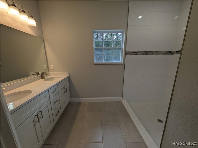 bathroom featuring tile patterned flooring and vanity