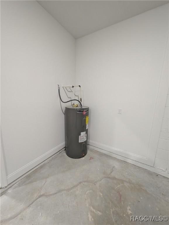 utility room featuring electric water heater