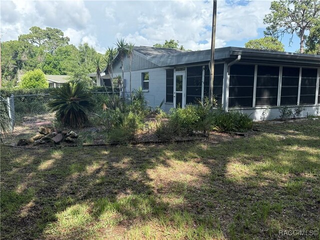 438 S Camillia Ave, Crystal River, FL 34429 - back of house with a sunroom