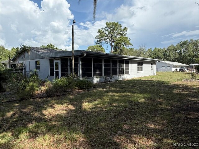 438 S Camillia Ave, Crystal River, FL 34429 - back of property featuring a sunroom and a yard
