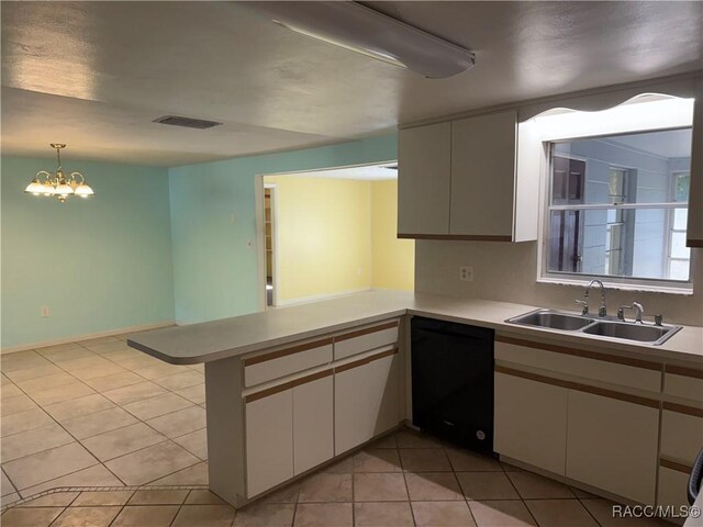 438 S Camillia Ave, Crystal River, FL 34429 - kitchen with dishwasher, a peninsula, light countertops, and white cabinets