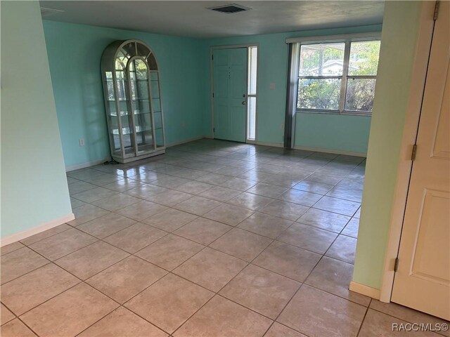 438 S Camillia Ave, Crystal River, FL 34429 - tiled empty room with baseboards