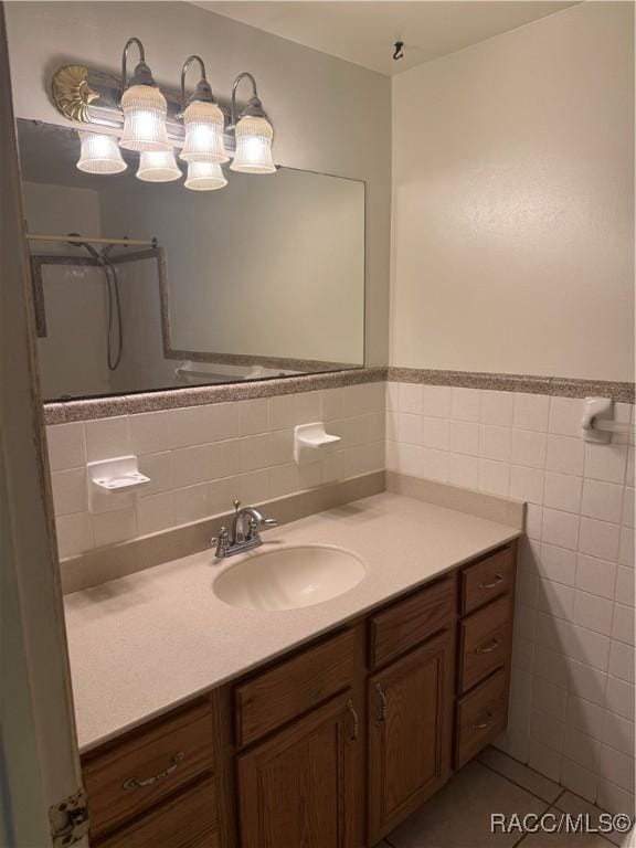 438 S Camillia Ave, Crystal River, FL 34429 - bathroom with vanity, tile walls, and wainscoting