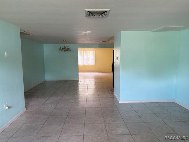438 S Camillia Ave, Crystal River, FL 34429 - tiled spare room with baseboards