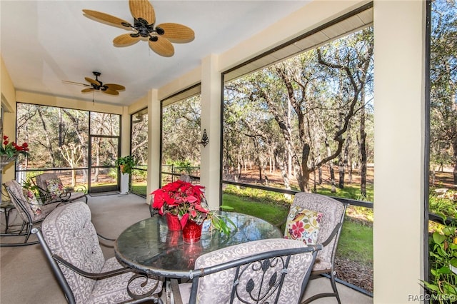 sunroom / solarium featuring ceiling fan