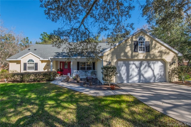 view of front facade featuring a porch, a garage, and a front yard