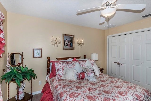 carpeted bedroom with ceiling fan and a closet