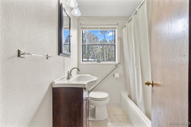 full bathroom featuring tile patterned floors, vanity, shower / bath combo, and toilet