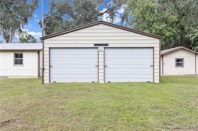 garage with a lawn