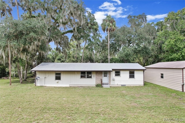 ranch-style house with a front lawn