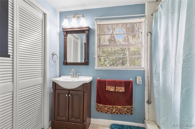 bathroom with vanity and a shower with shower curtain