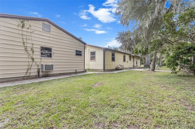 back of house featuring a yard