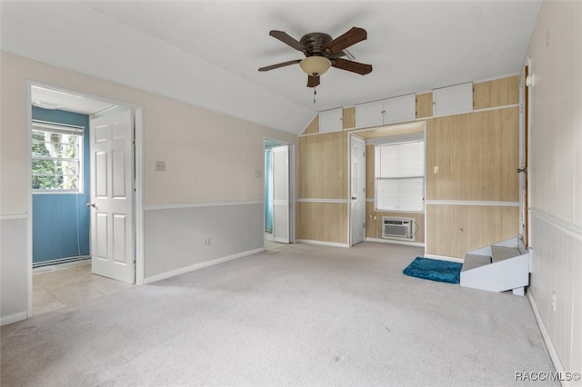 unfurnished living room with ceiling fan, light carpet, and vaulted ceiling