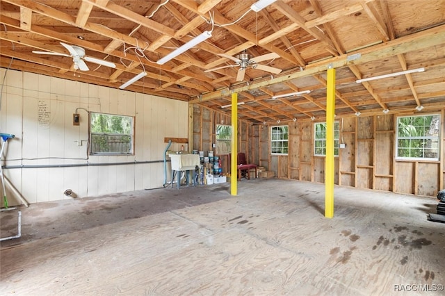 interior space with ceiling fan