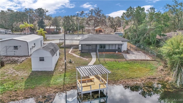 9019 E Gulf To Lake Hwy, Inverness, FL 34450 - rear view of property with a lawn, a water view, boat lift, and view of scattered trees