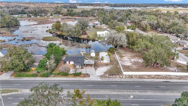 9019 E Gulf To Lake Hwy, Inverness, FL 34450 - aerial view of property and surrounding area featuring a nearby body of water and nearby suburban area