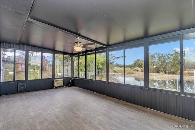 9019 E Gulf To Lake Hwy, Inverness, FL 34450 - unfurnished sunroom featuring a ceiling fan, a wall mounted AC, plenty of natural light, and a water view