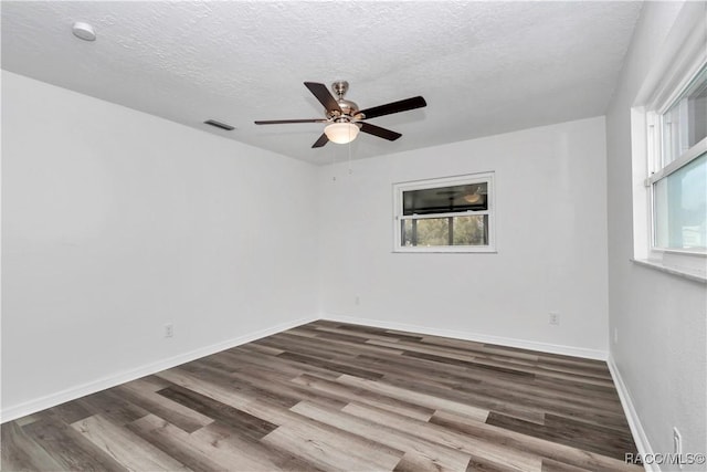 9019 E Gulf To Lake Hwy, Inverness, FL 34450 - unfurnished room with ceiling fan, wood finished floors, and a textured ceiling