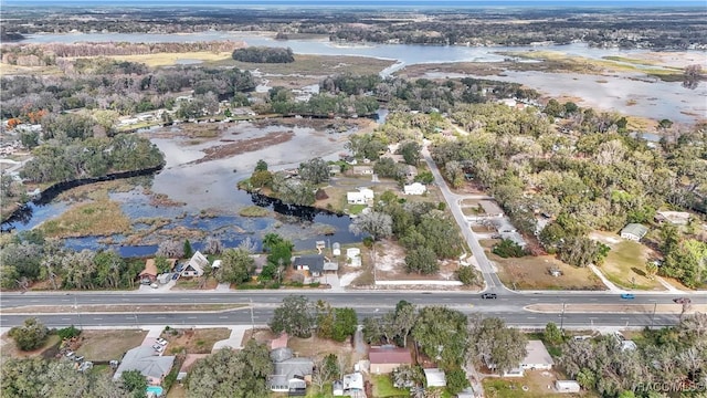 9019 E Gulf To Lake Hwy, Inverness, FL 34450 - aerial view of property and surrounding area featuring a nearby body of water and nearby suburban area