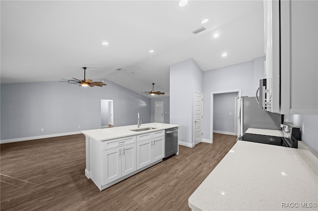 kitchen featuring a kitchen island with sink, vaulted ceiling, appliances with stainless steel finishes, dark hardwood / wood-style flooring, and white cabinetry