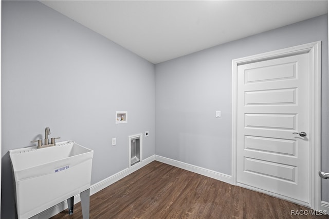 washroom featuring electric dryer hookup, dark hardwood / wood-style floors, sink, and hookup for a washing machine