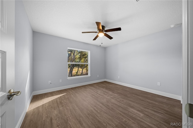 unfurnished room featuring a textured ceiling, dark hardwood / wood-style flooring, and ceiling fan