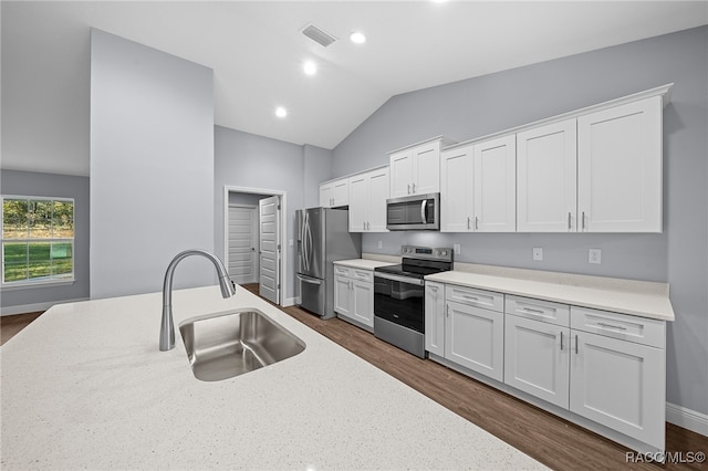 kitchen with white cabinets, stainless steel appliances, dark wood-type flooring, and sink