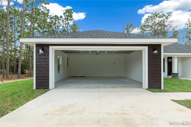 garage with a yard