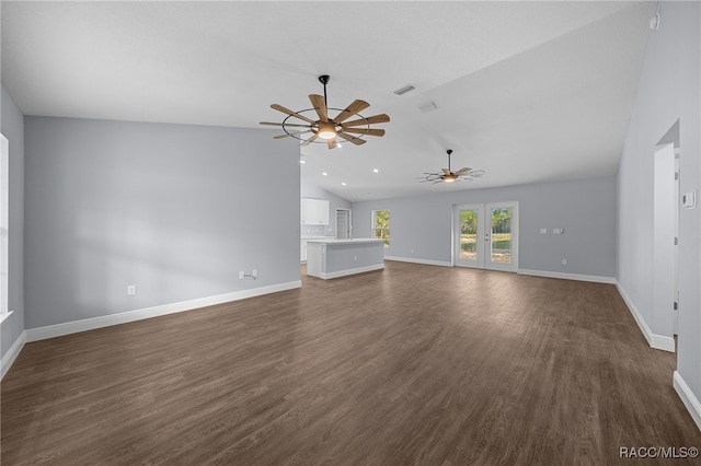 unfurnished living room with lofted ceiling, ceiling fan, and dark wood-type flooring