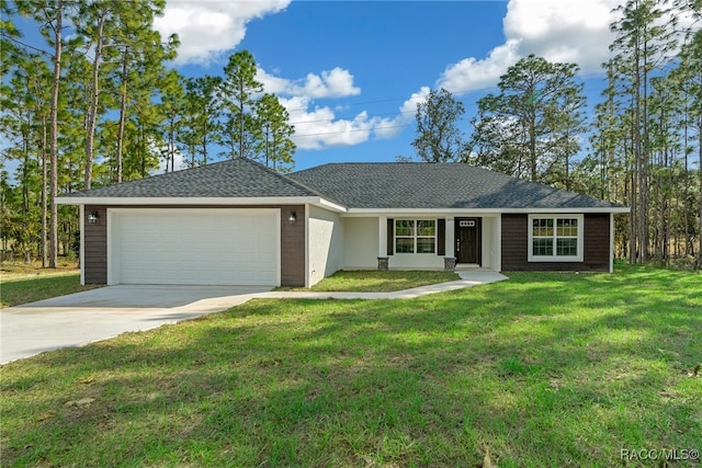 ranch-style house featuring a front lawn and a garage