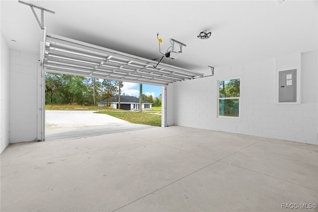 garage featuring a garage door opener and electric panel