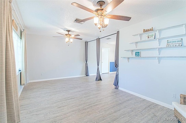 6176 W Pinedale Cir, Crystal River, FL 34429 - empty room with a textured ceiling, light wood-type flooring, and a ceiling fan