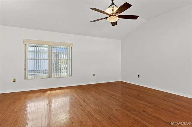 empty room with wood-type flooring, lofted ceiling, and ceiling fan