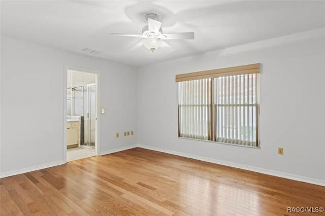 unfurnished room with ceiling fan and light hardwood / wood-style floors