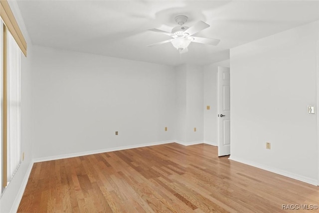 unfurnished room featuring light hardwood / wood-style floors and ceiling fan