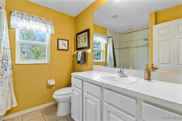 bathroom featuring visible vents, toilet, a tile shower, vanity, and tile patterned flooring