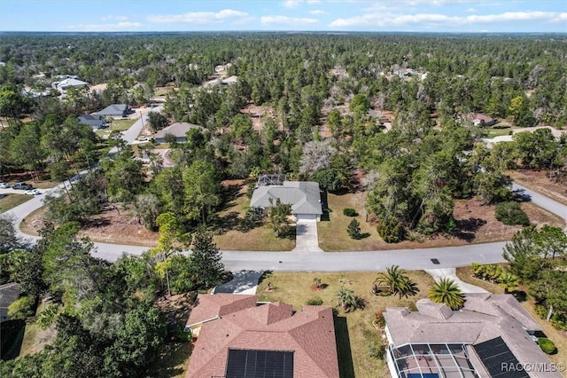 birds eye view of property featuring a residential view and a view of trees