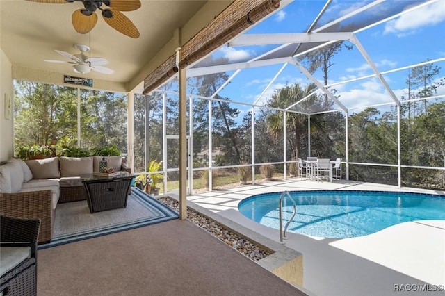 pool with an outdoor hangout area, a patio, a lanai, and a ceiling fan