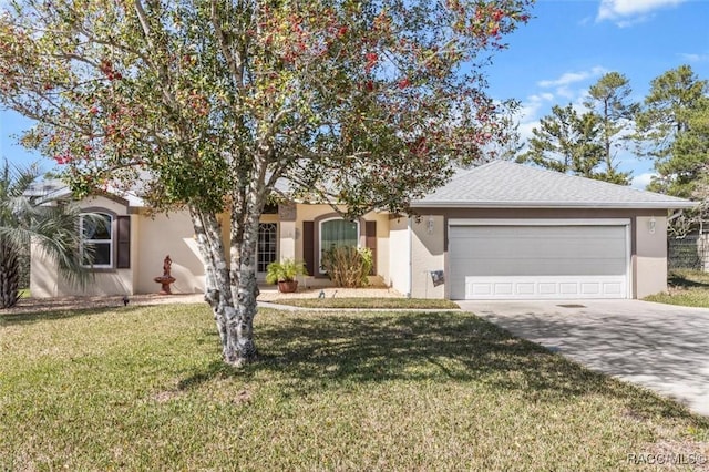 view of front of home featuring an attached garage, concrete driveway, and stucco siding