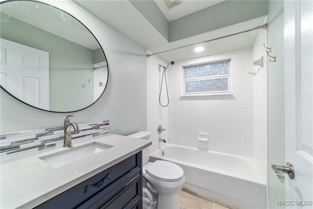 19028 SW 101st Pl, Dunnellon, FL 34432 - full bathroom featuring toilet, shower / bathtub combination, vanity, and backsplash