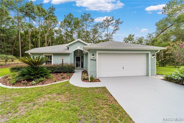 19028 SW 101st Pl, Dunnellon, FL 34432 - ranch-style house featuring concrete driveway, an attached garage, a front yard, and stucco siding