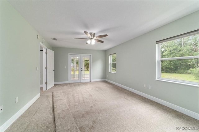 19028 SW 101st Pl, Dunnellon, FL 34432 - carpeted spare room featuring french doors, a ceiling fan, and baseboards