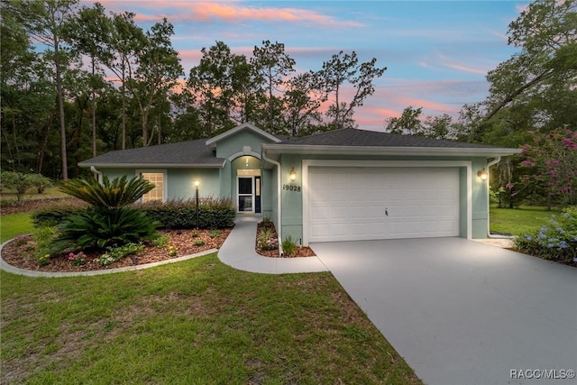19028 SW 101st Pl, Dunnellon, FL 34432 - ranch-style house featuring concrete driveway, a garage, a front lawn, and stucco siding