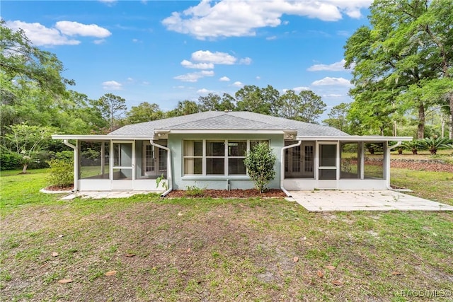 19028 SW 101st Pl, Dunnellon, FL 34432 - back of house featuring a sunroom and a yard