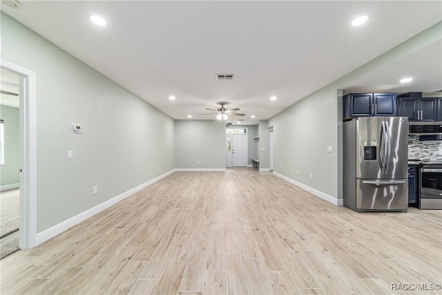 19028 SW 101st Pl, Dunnellon, FL 34432 - unfurnished living room with light wood finished floors, ceiling fan, recessed lighting, and baseboards