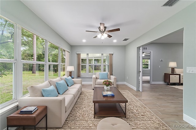 19028 SW 101st Pl, Dunnellon, FL 34432 - living area with ceiling fan, light wood-style floors, plenty of natural light, baseboards, and recessed lighting