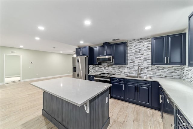 19028 SW 101st Pl, Dunnellon, FL 34432 - kitchen with appliances with stainless steel finishes, a sink, light countertops, decorative backsplash, and recessed lighting