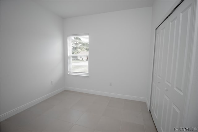 unfurnished bedroom featuring a closet